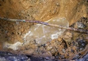 Photo of a leaking copper plumbing pipe